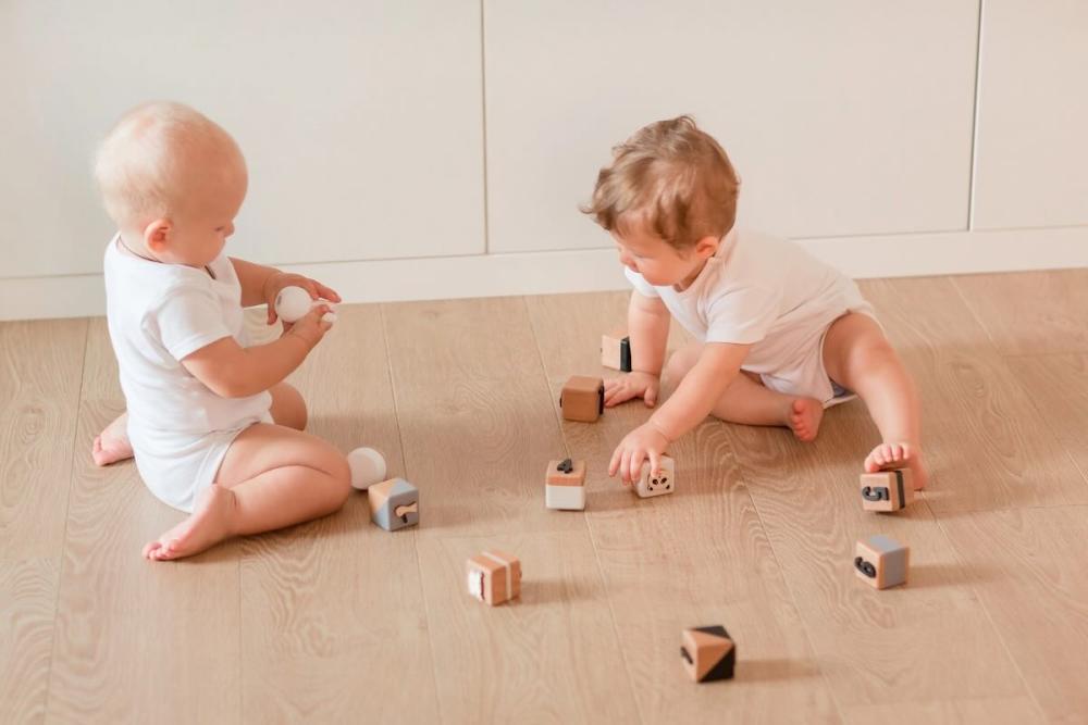 Babies playing with ABC blocks