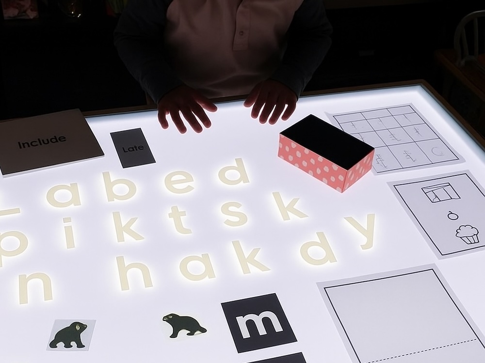 Alphabet activities on an LED activity table