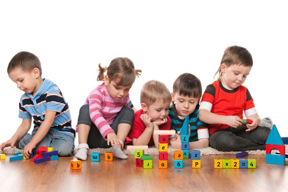 Kids playing with construction blocks