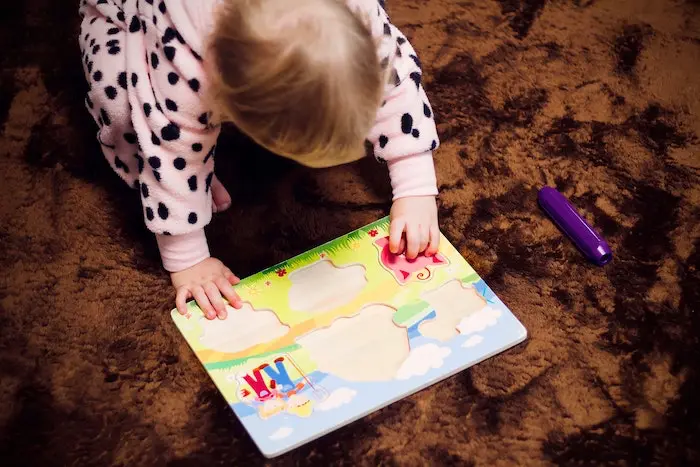 Child Playing with Puzzle
