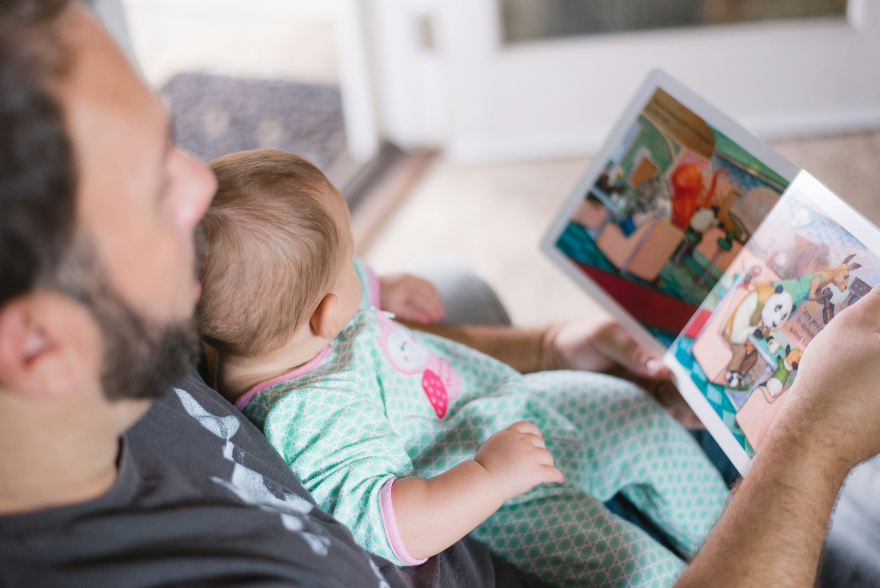 A father reading a Personalized Storybook to his child