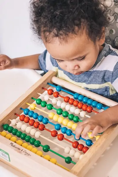 Child Playing with Abacus