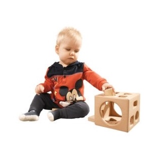 Child playing with Montessori wooden toy