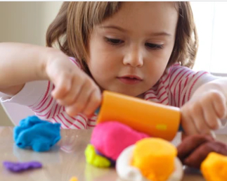 Girl playing with play-doh