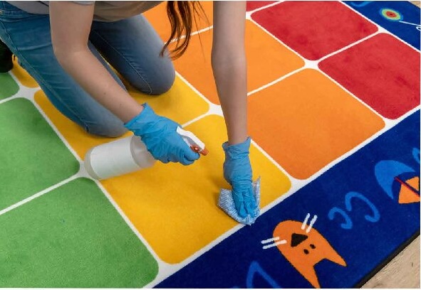 spot cleaning a classroom carpet