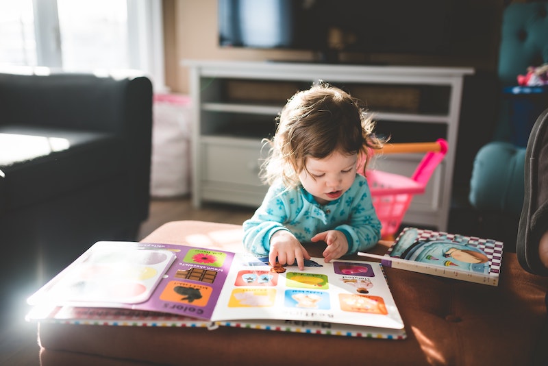 Girl reading Personalized Story Book