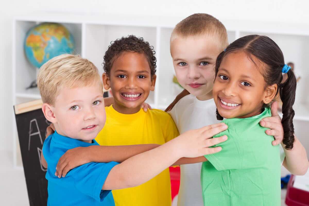 Group hug on a circle time rug