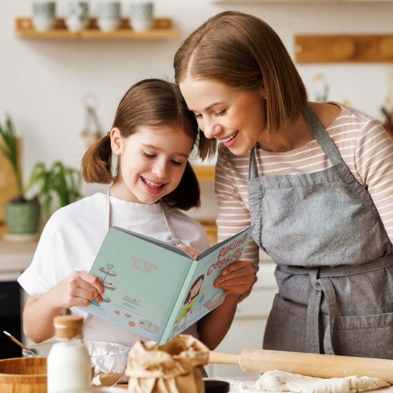 Mother and daughter baking together from a personalized book for kids about baking